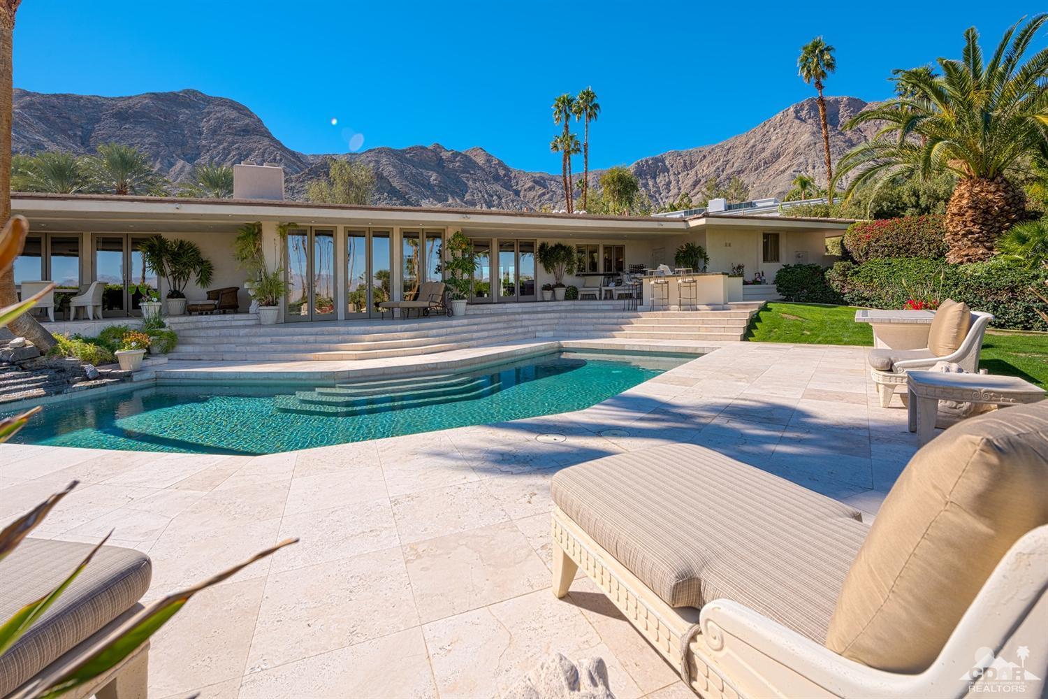 70375 Thunderbird Road Rancho Mirage, CA 92270 - Photo 1 of 54 a view of a patio with couches chairs and a table and chairs