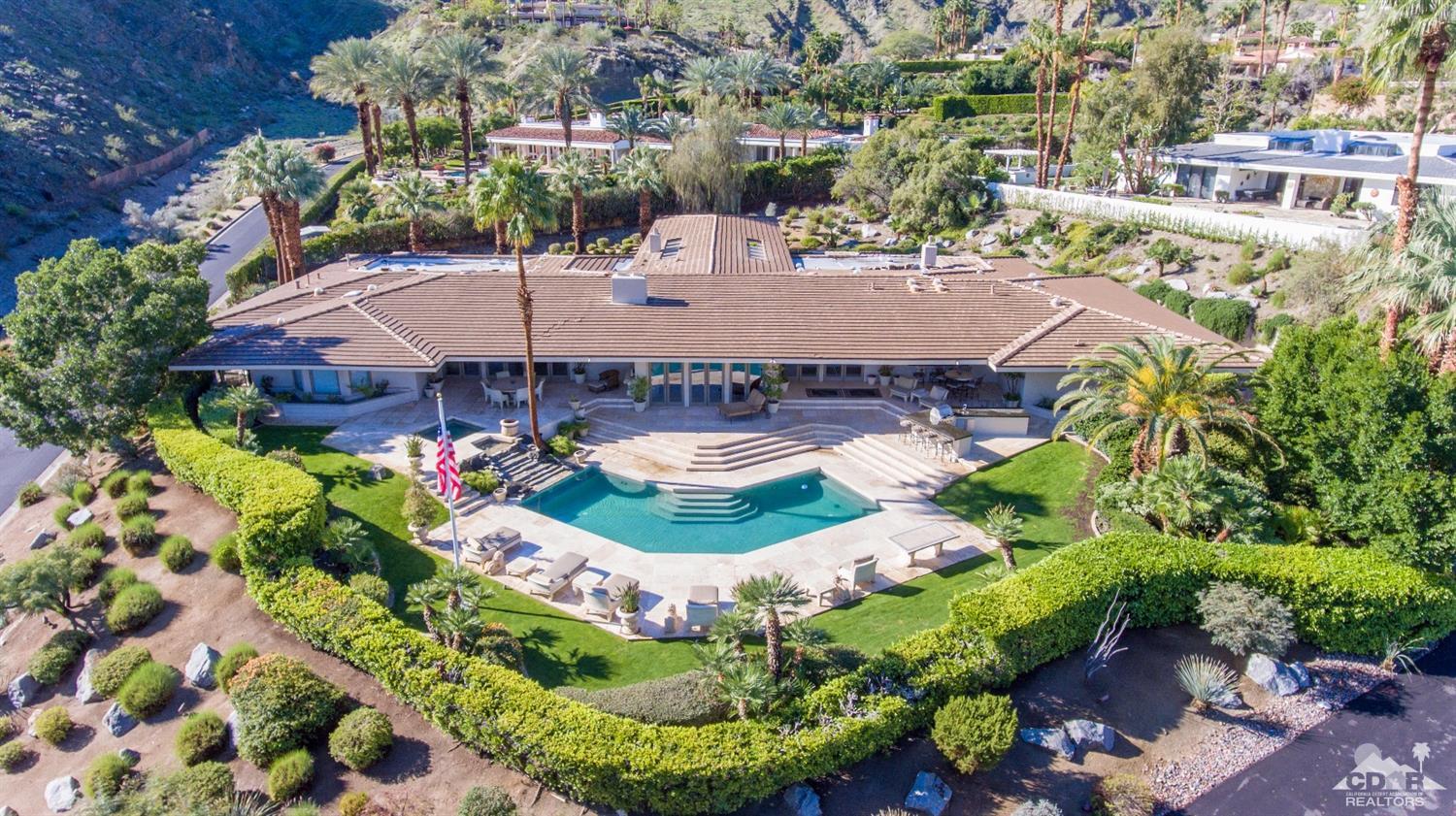70375 Thunderbird Road Rancho Mirage, CA 92270 - Photo 2 of 54 an aerial view of residential houses with outdoor space and trees