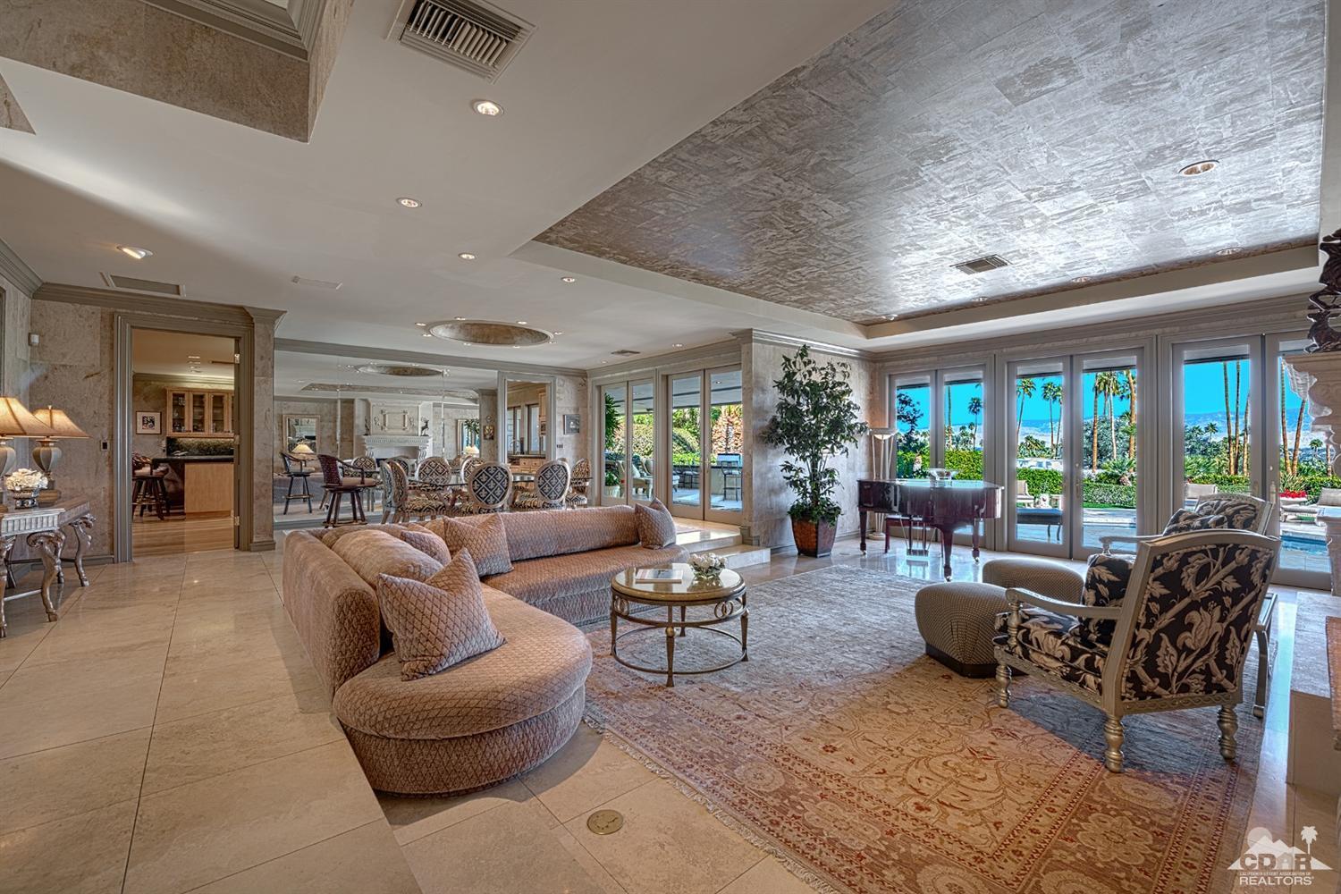 70375 Thunderbird Road Rancho Mirage, CA 92270 - Photo 11 of 54 a living room with furniture and a large window