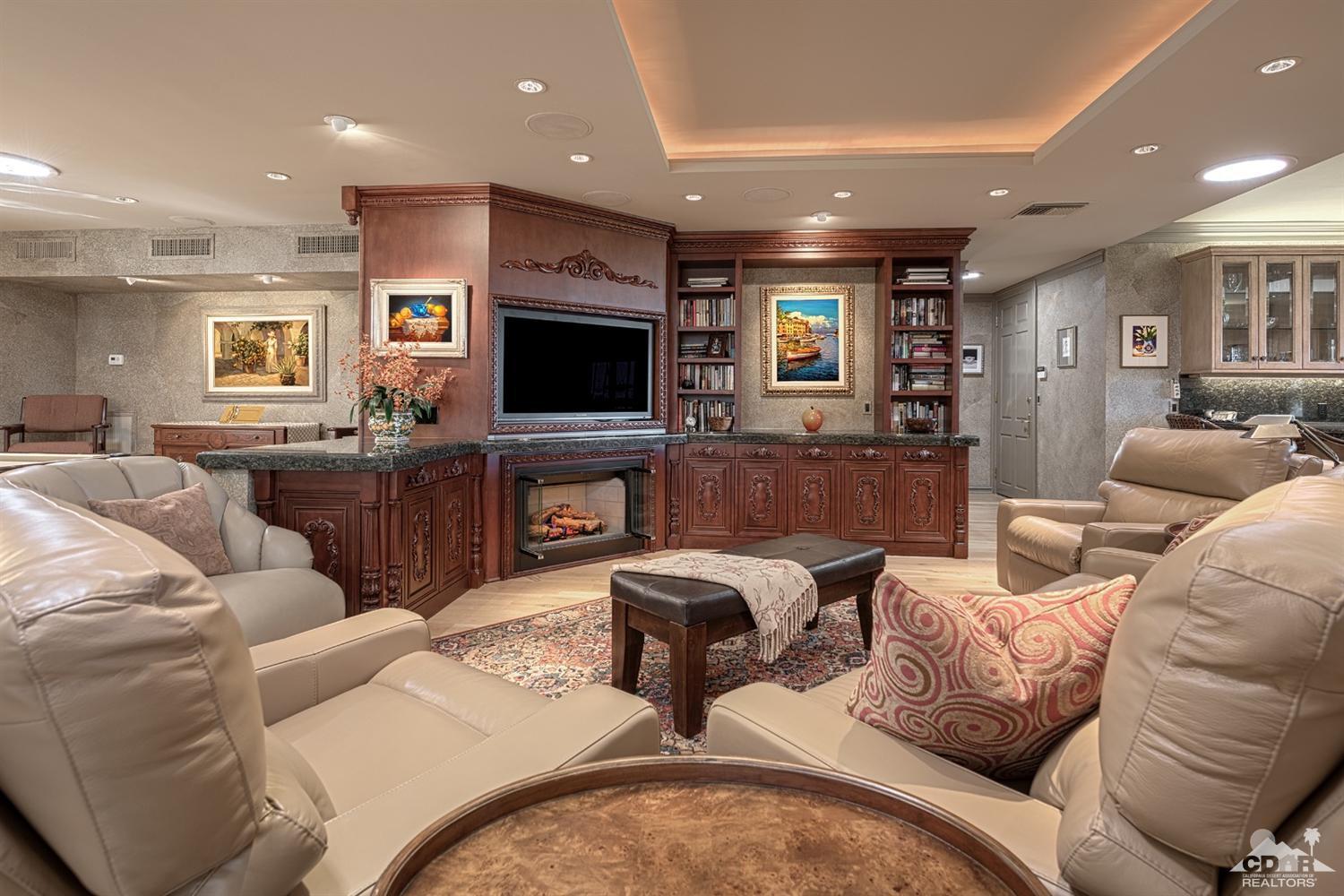 70375 Thunderbird Road Rancho Mirage, CA 92270 - Photo 16 of 54 a living room with furniture and a flat screen tv