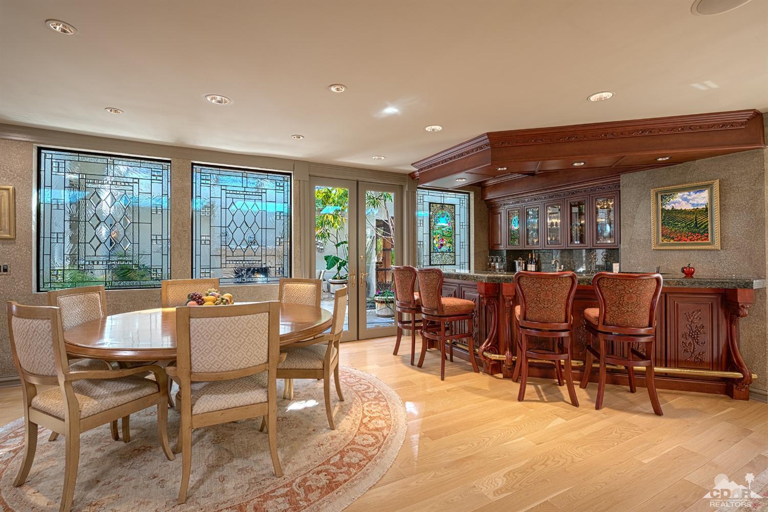70375 Thunderbird Road Rancho Mirage, CA 92270 - Photo 18 of 54 a view of a dining room with furniture window and outside view