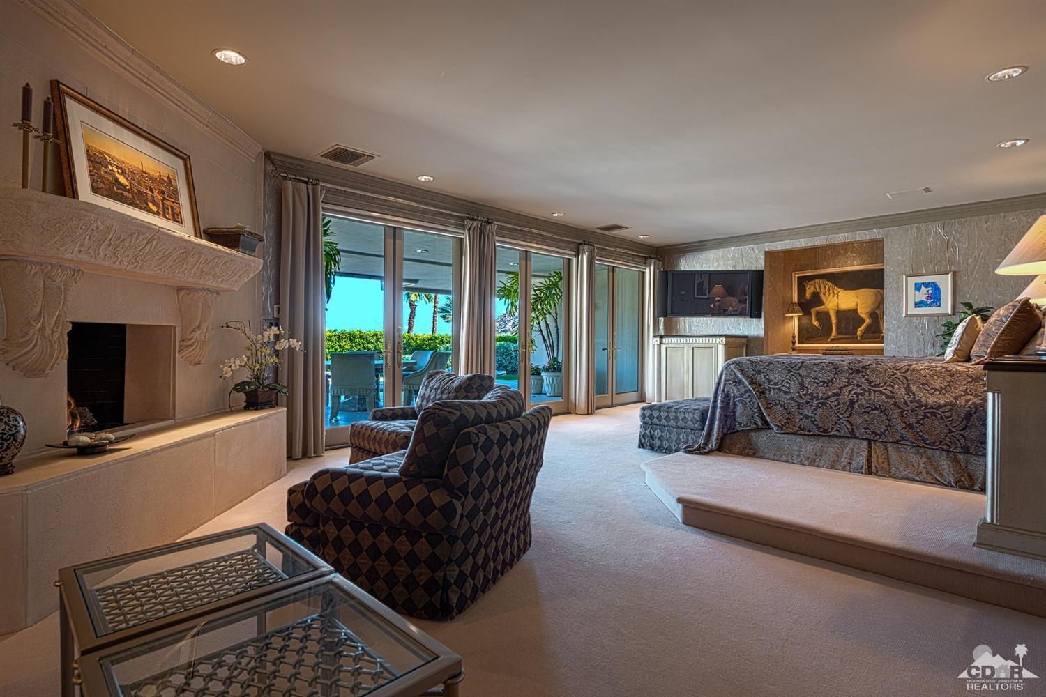 70375 Thunderbird Road Rancho Mirage, CA 92270 - Photo 23 of 54 a living room with furniture and a flat screen tv