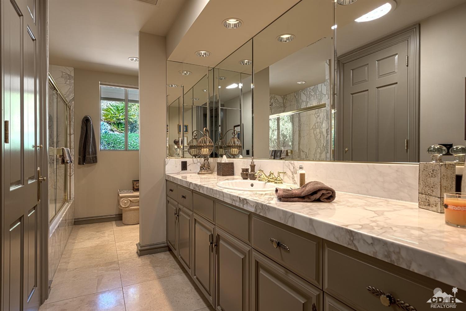 70375 Thunderbird Road Rancho Mirage, CA 92270 - Photo 34 of 54 a bathroom with a double vanity sink and a mirror