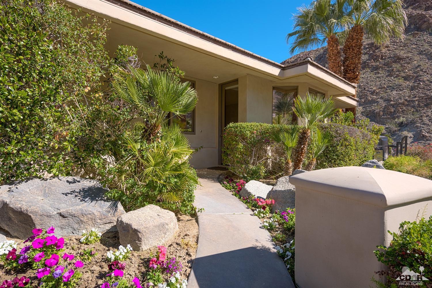 70375 Thunderbird Road Rancho Mirage, CA 92270 - Photo 35 of 54 a front view of a house with a yard