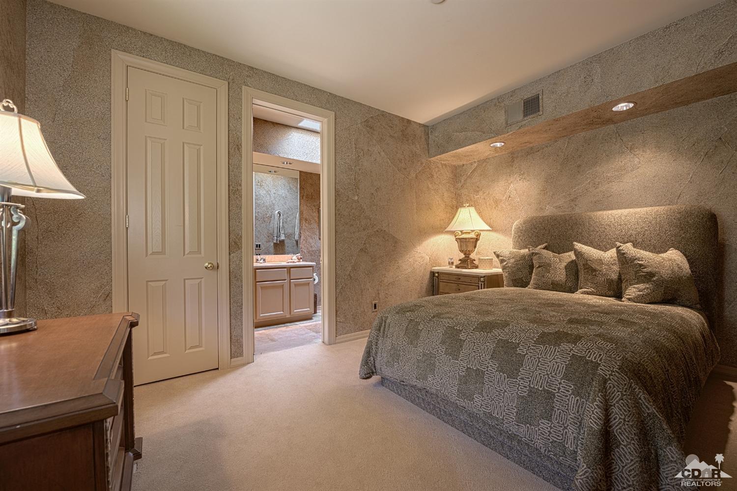 70375 Thunderbird Road Rancho Mirage, CA 92270 - Photo 38 of 54 a spacious bedroom with two beds and a lamp