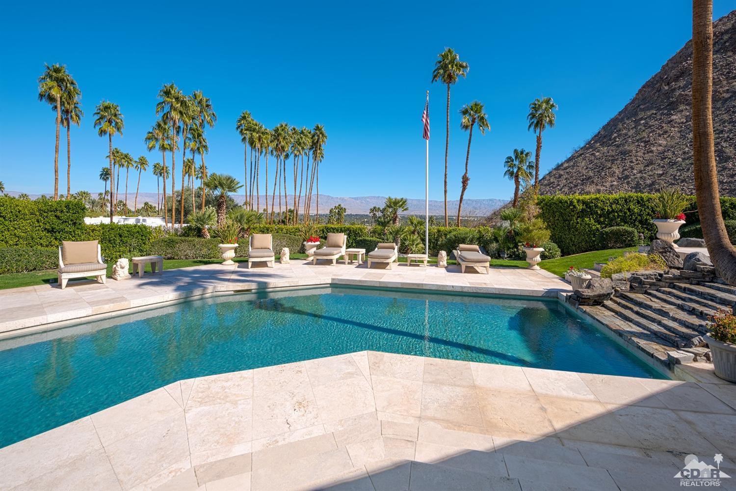 70375 Thunderbird Road Rancho Mirage, CA 92270 - Photo 5 of 54 a swimming pool with outdoor seating and yard