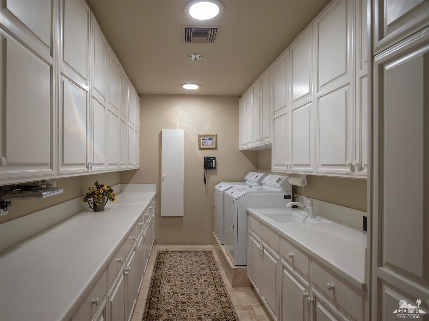 70375 Thunderbird Road Rancho Mirage, CA 92270 - Photo 41 of 54 a bathroom with a sink double vanity and a bathtub