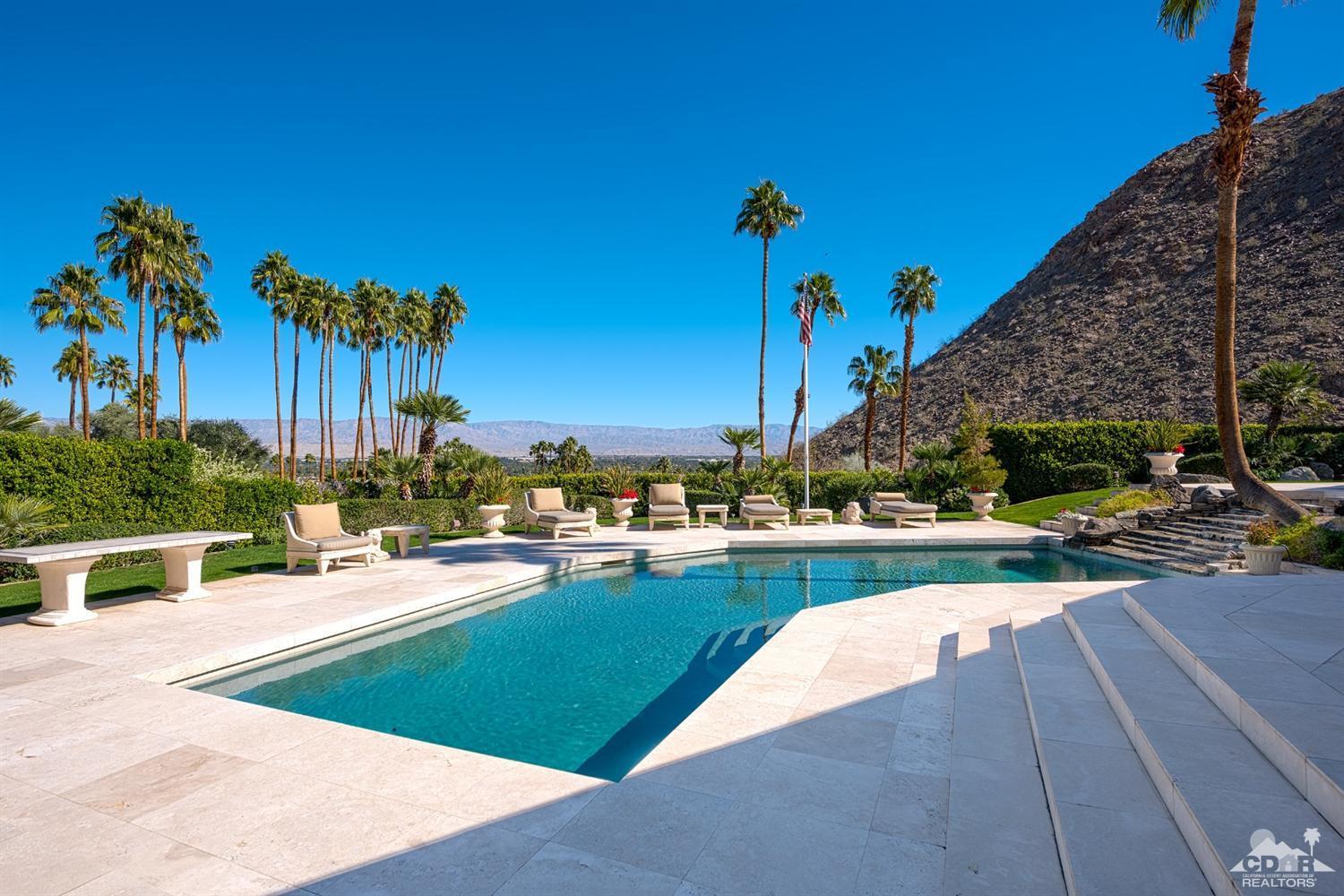 70375 Thunderbird Road Rancho Mirage, CA 92270 - Photo 45 of 54 a view of a swimming pool and lounge chairs