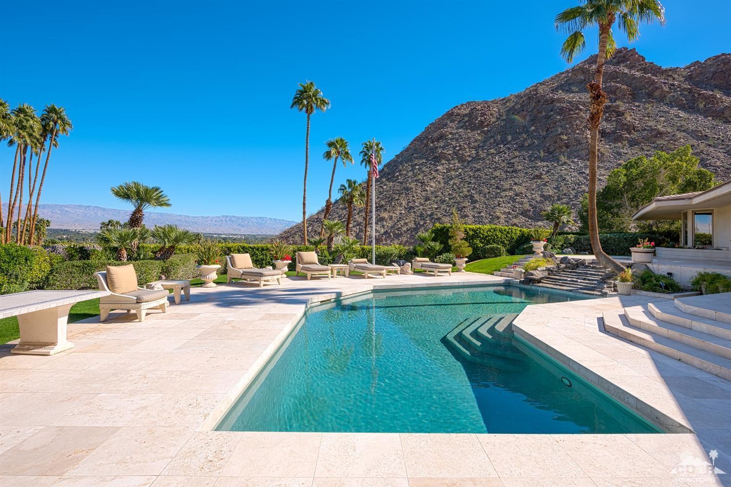70375 Thunderbird Road Rancho Mirage, CA 92270 - Photo 46 of 54 a swimming pool with outdoor seating and yard