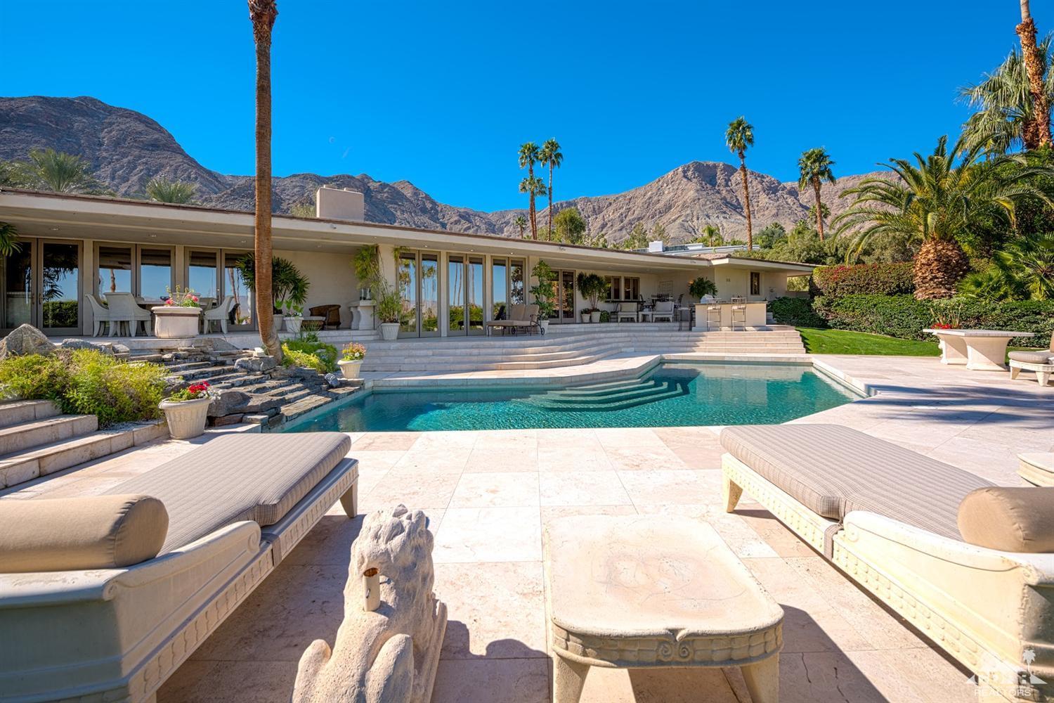 70375 Thunderbird Road Rancho Mirage, CA 92270 - Photo 48 of 54 a view of a house with swimming pool and sitting area