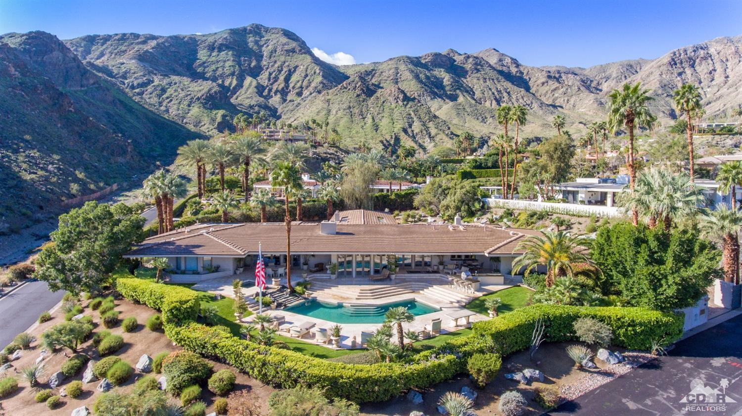 70375 Thunderbird Road Rancho Mirage, CA 92270 - Photo 50 of 54 a view of a swimming pool with a yard and plants