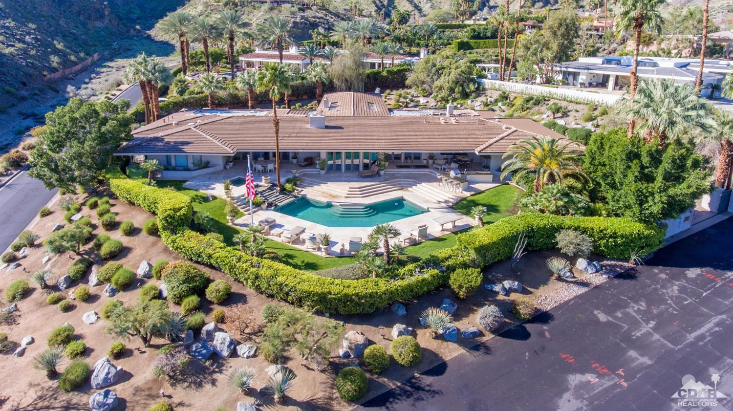 70375 Thunderbird Road Rancho Mirage, CA 92270 - Photo 51 of 54 a view of a swimming pool with a yard