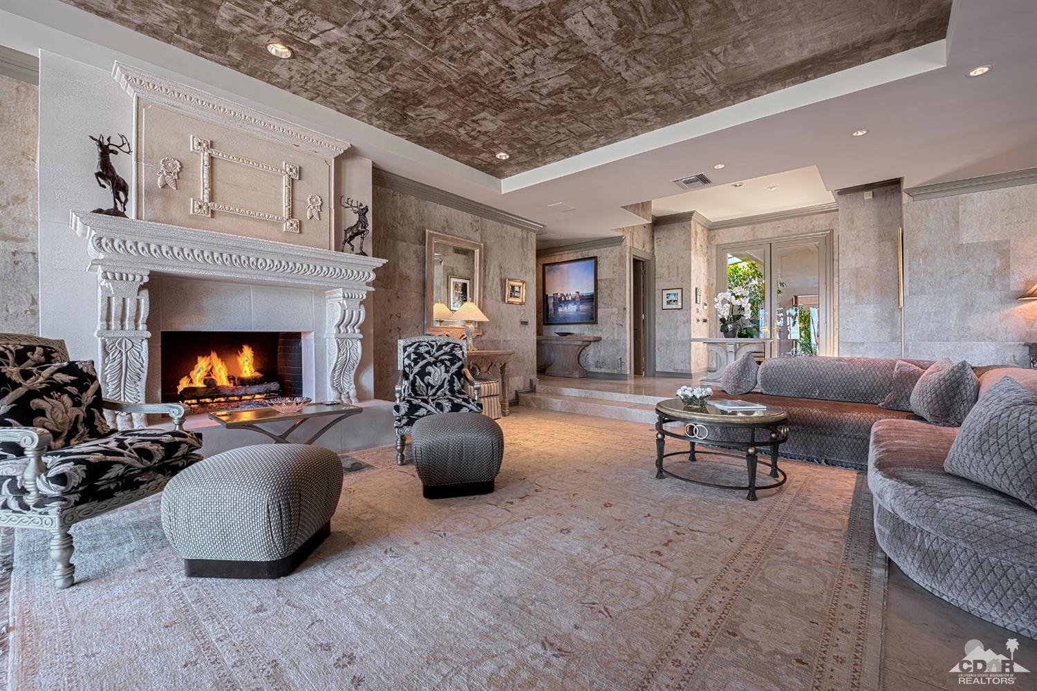 70375 Thunderbird Road Rancho Mirage, CA 92270 - Photo 9 of 54 a living room with furniture and a fireplace