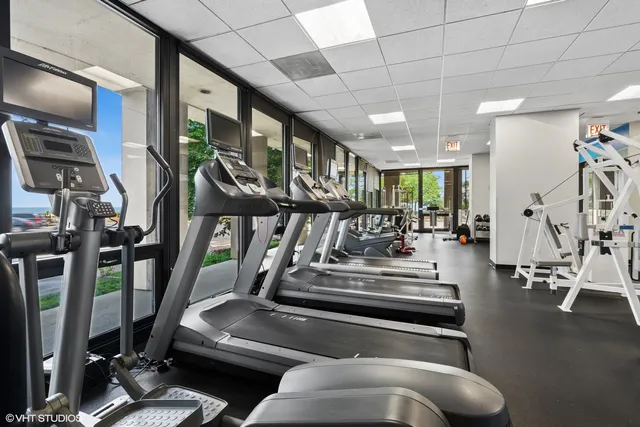 a view of gym room with gym equipment
