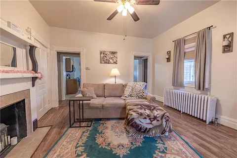 a living room with furniture and a fireplace