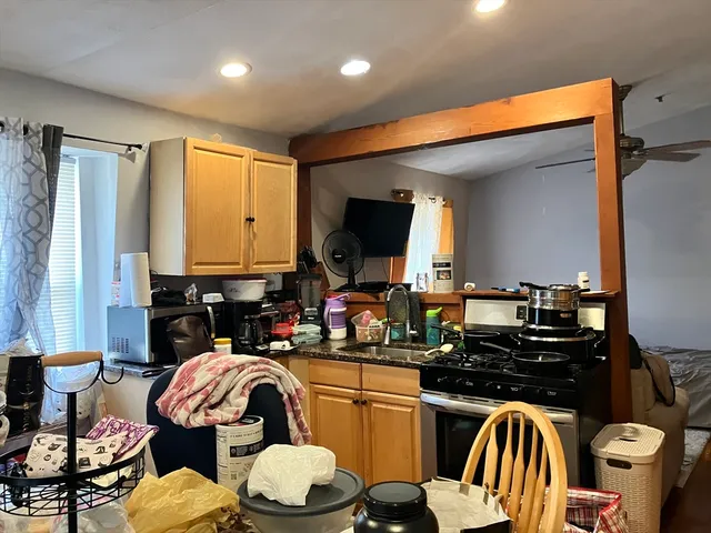 a kitchen with a sink appliances and cabinets