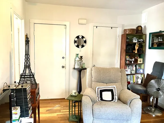 a living room with furniture and natural light