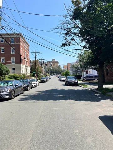 a view of a street with cars