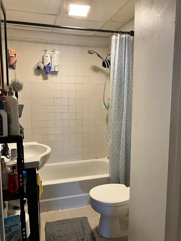 a bathroom with a sink a toilet and a bathtub