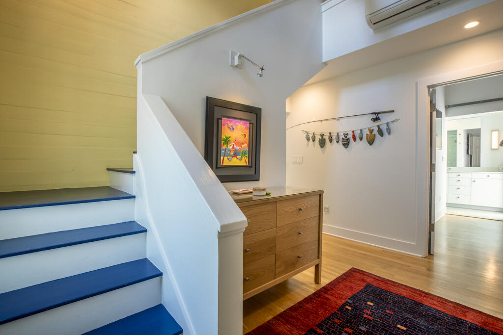 525 Louisa Street Key West, FL 33040 - Photo 18 of 43 a view of entryway with wooden floor and stairs