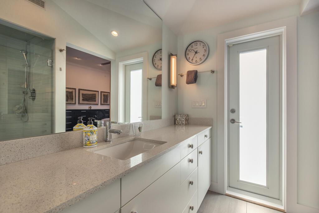 525 Louisa Street Key West, FL 33040 - Photo 39 of 43 a bathroom with a granite countertop sink vanity and a mirror