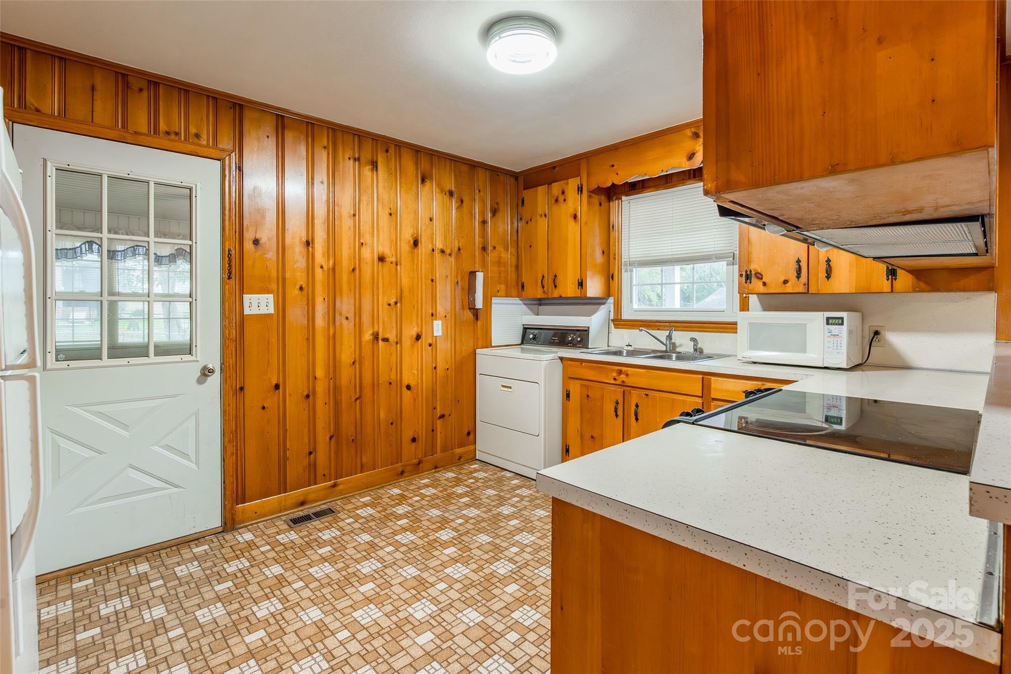 2100 J B Denton Road Lancaster, SC 29720 - Photo 11 of 44 a view of a kitchen with a sink and cabinets