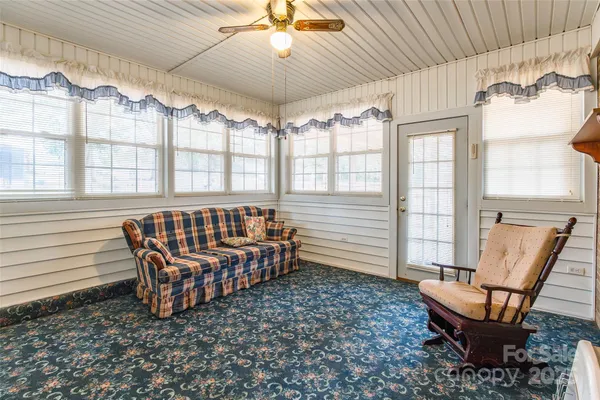 a view of a livingroom with furniture