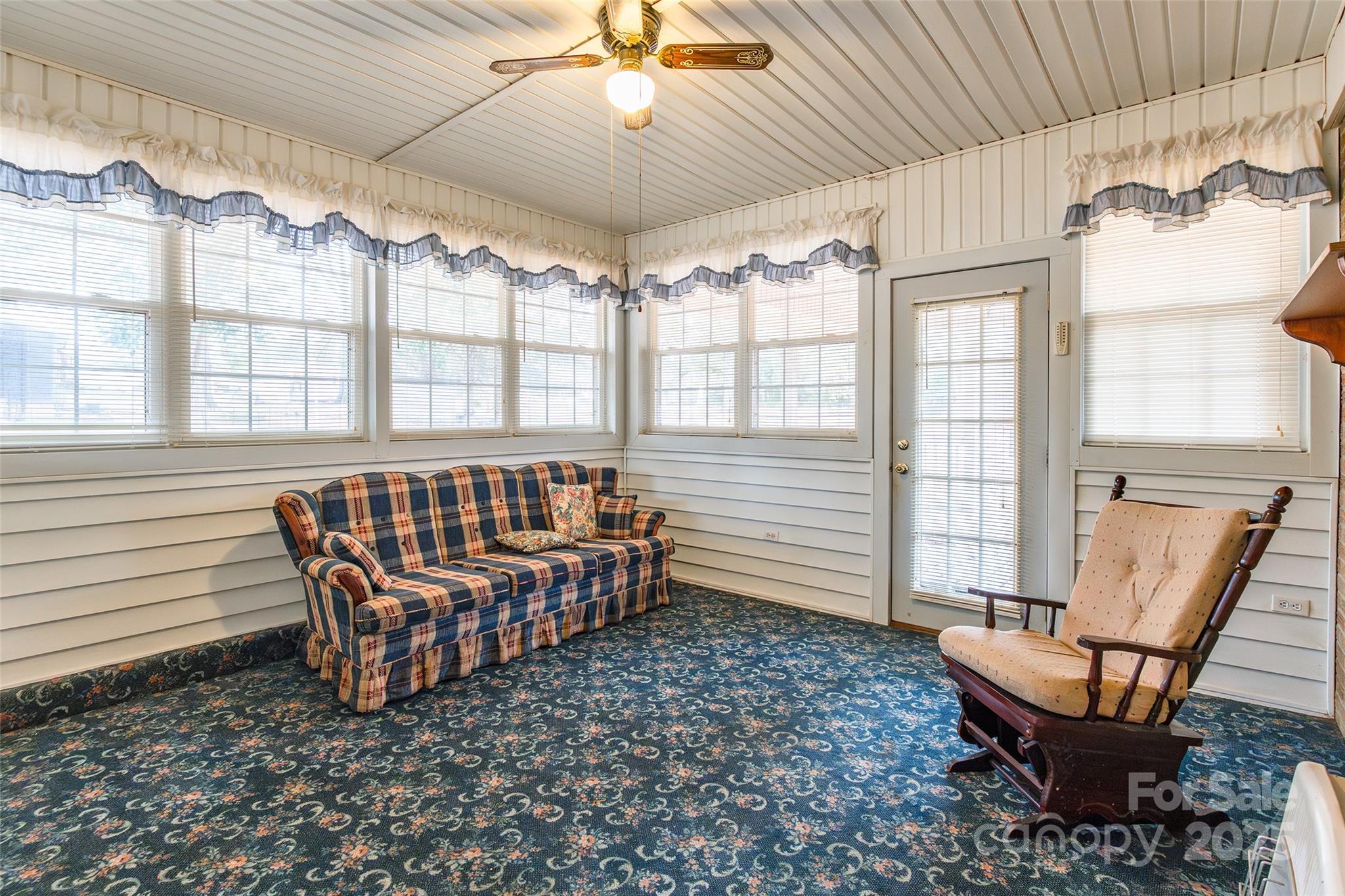 2100 J B Denton Road Lancaster, SC 29720 - Photo 27 of 44 a view of a dining room with furniture wooden floor and chandelier