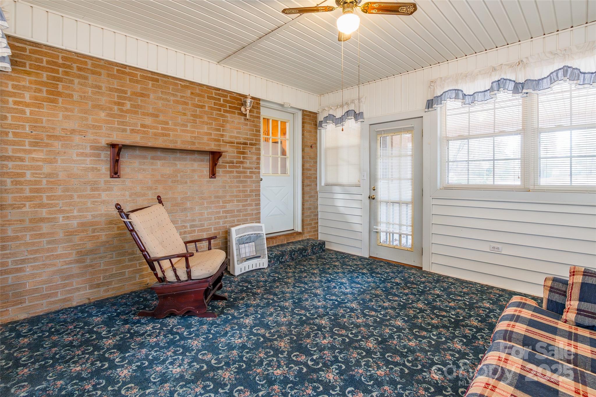 2100 J B Denton Road Lancaster, SC 29720 - Photo 29 of 44 a view of a porch with a table and chairs