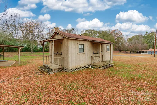 a view of a hallway with a chandelier fan