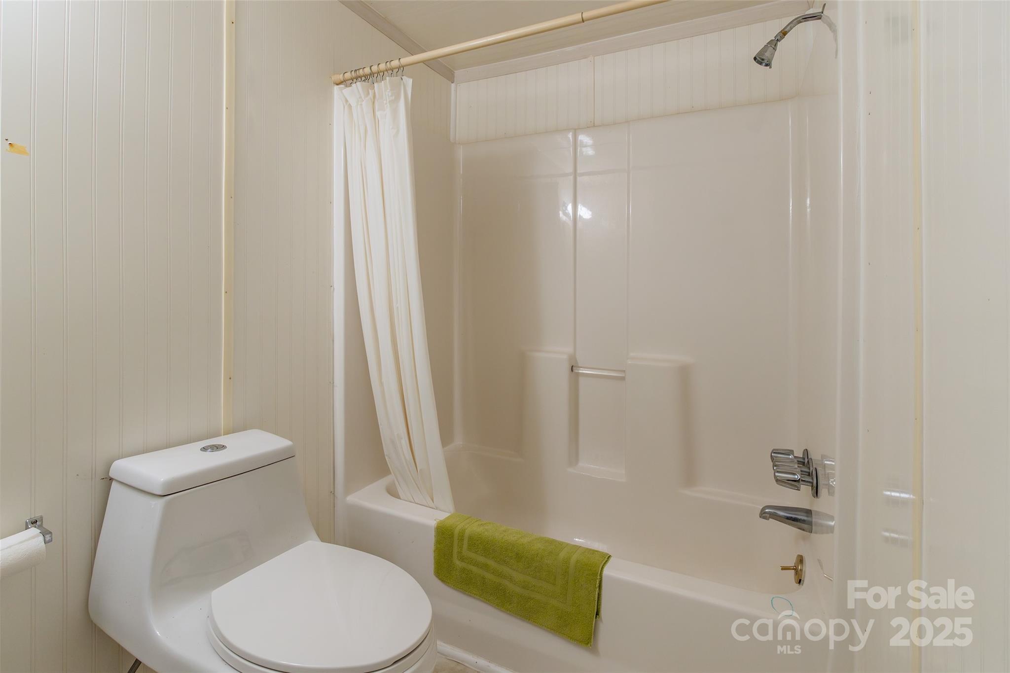 2100 J B Denton Road Lancaster, SC 29720 - Photo 41 of 44 a white toilet sitting next to a bath tub