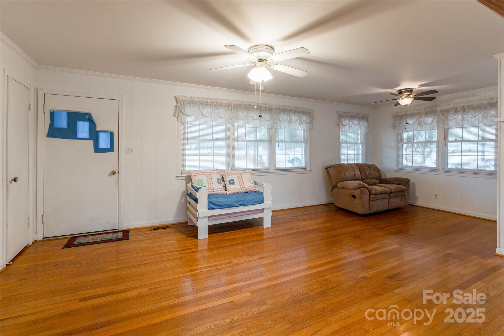 2100 J B Denton Road Lancaster, SC 29720 - Photo 6 of 44 a living room with furniture and a chandelier