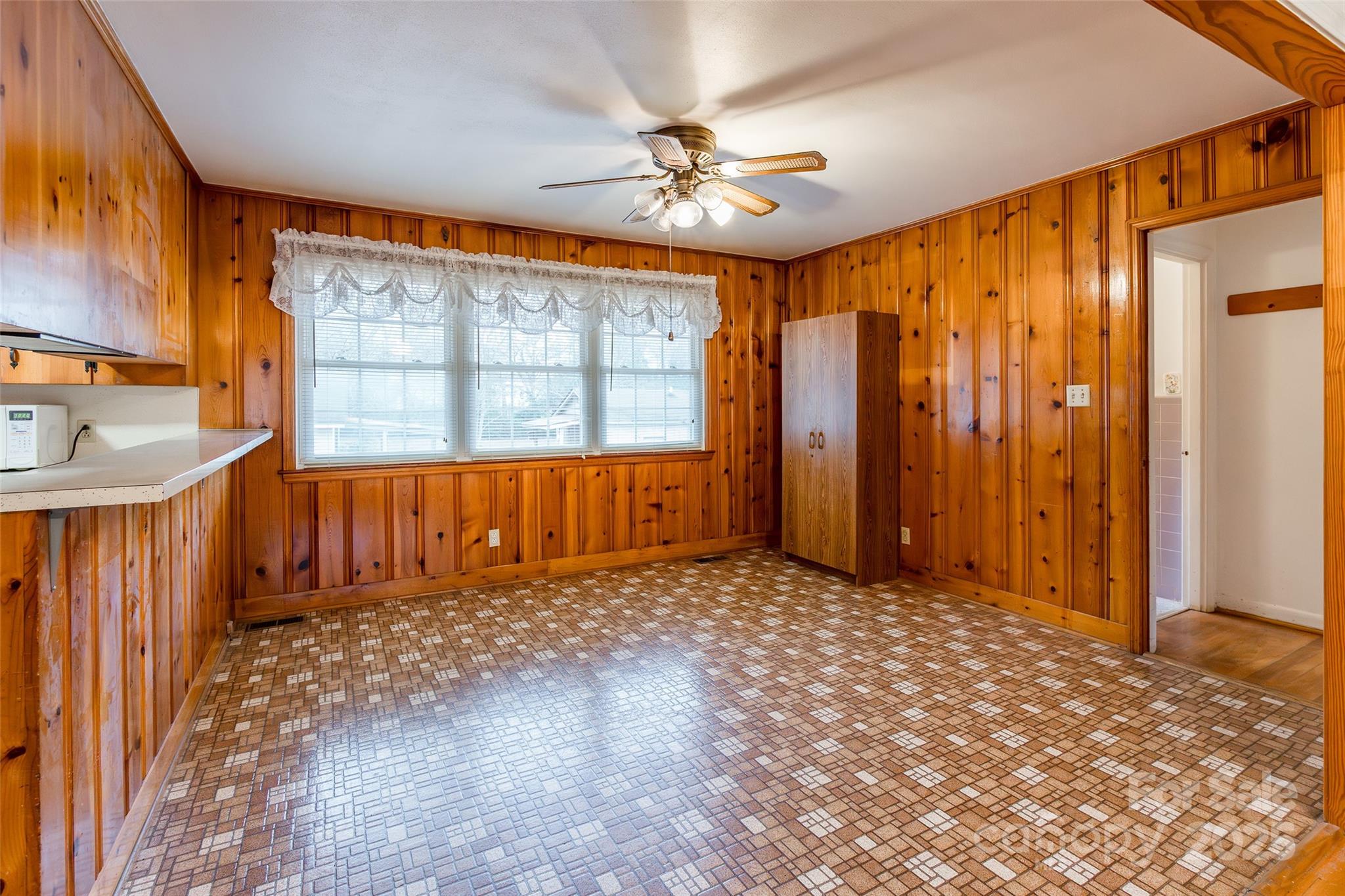 2100 J B Denton Road Lancaster, SC 29720 - Photo 9 of 44 a view of a room with a window and a ceiling fan