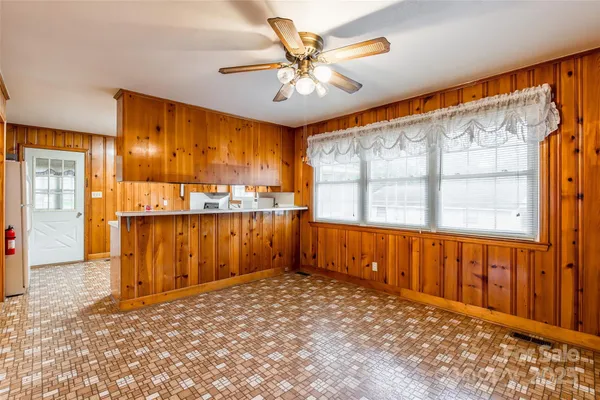 a view of a kitchen with a sink and cabinets