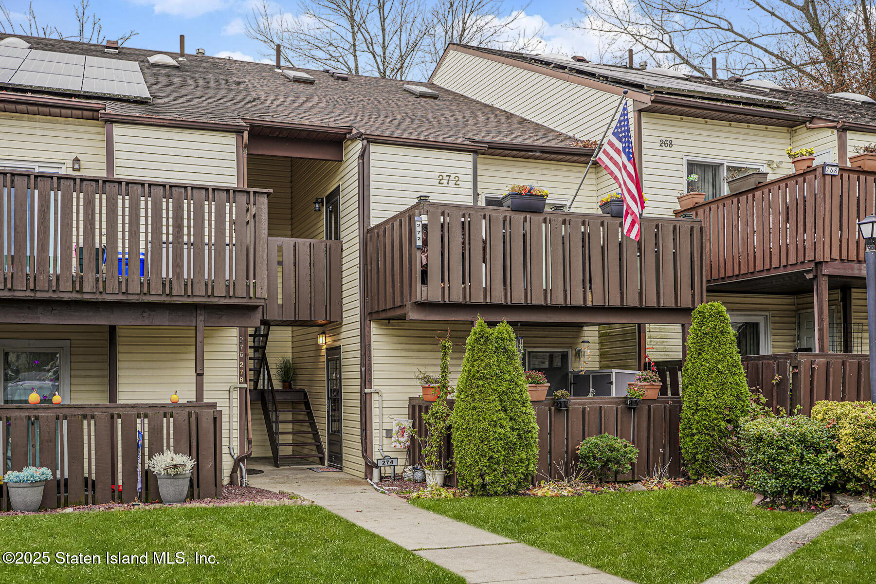272 Timber Ridge Drive Staten Island, NY 10306 - Photo 1 of 26 a view of a house with wooden fence