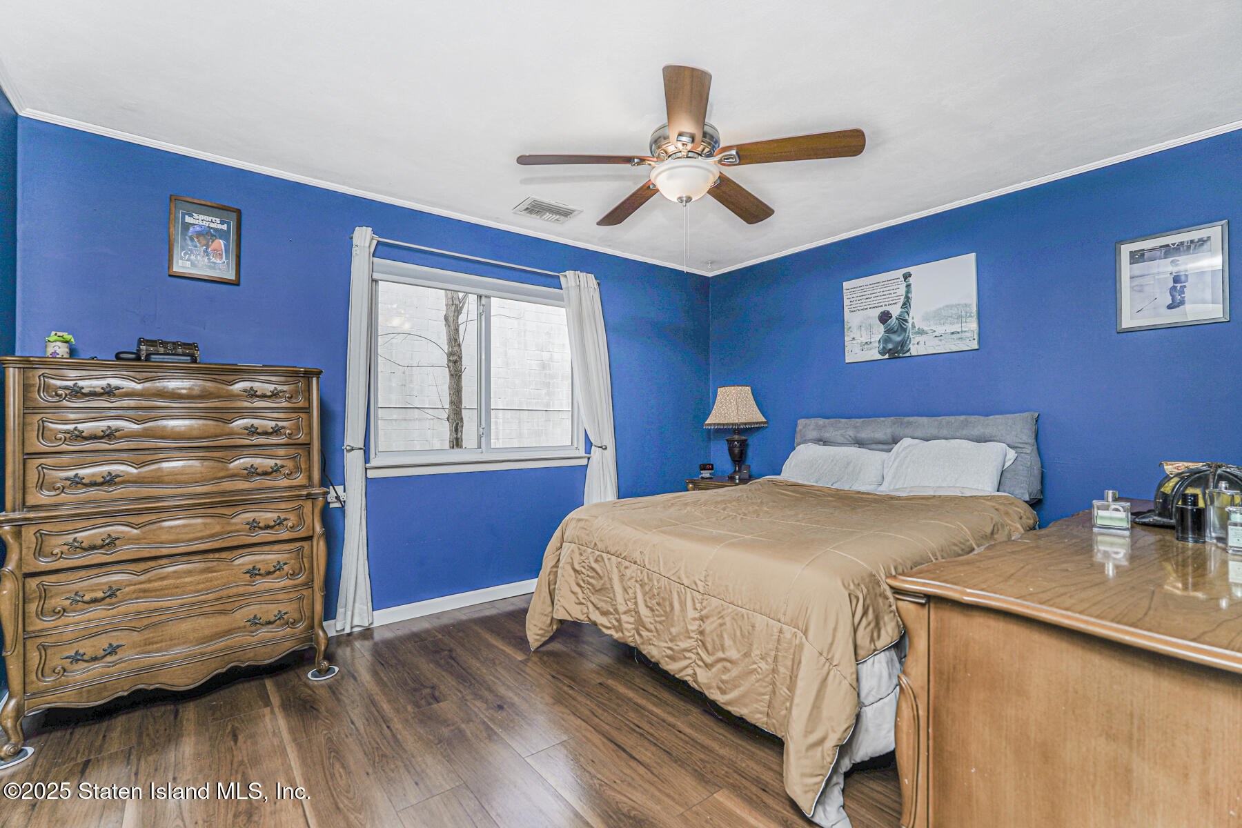 272 Timber Ridge Drive Staten Island, NY 10306 - Photo 13 of 26 a bedroom with a bed and a dresser