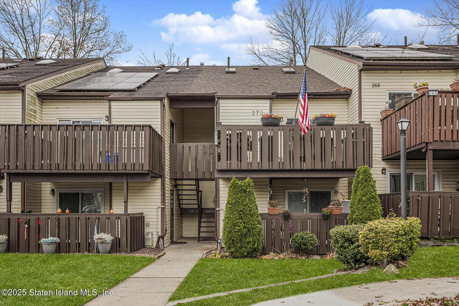 272 Timber Ridge Drive Staten Island, NY 10306 - Photo 2 of 26 a front view of a house with garden