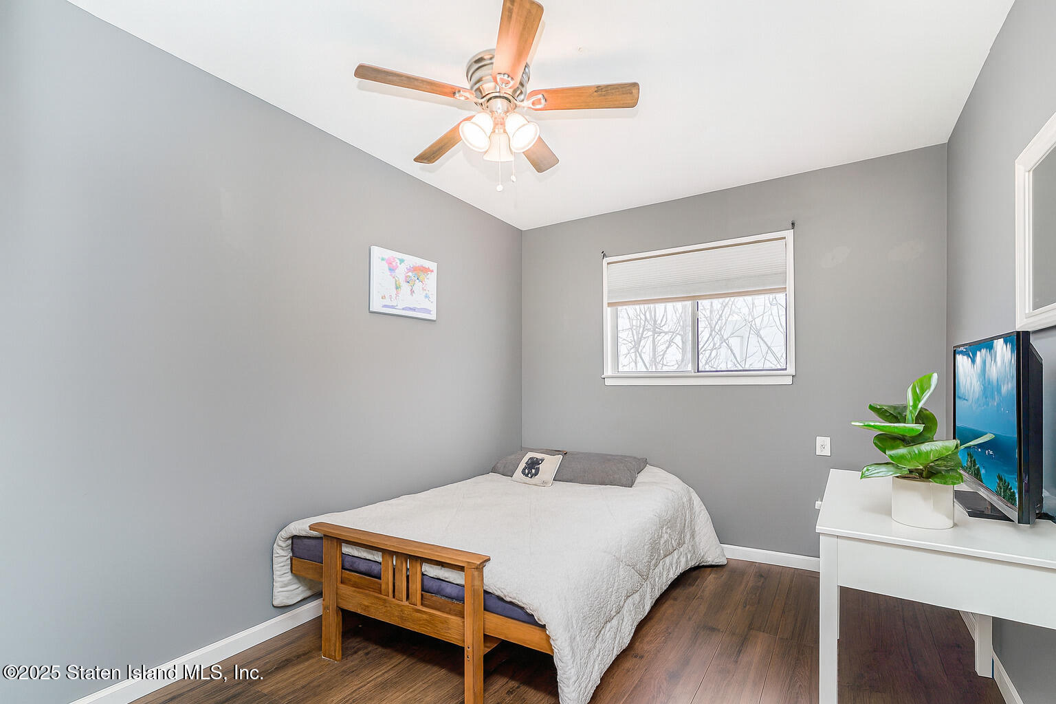 272 Timber Ridge Drive Staten Island, NY 10306 - Photo 26 of 26 a bedroom with a bed table and a window