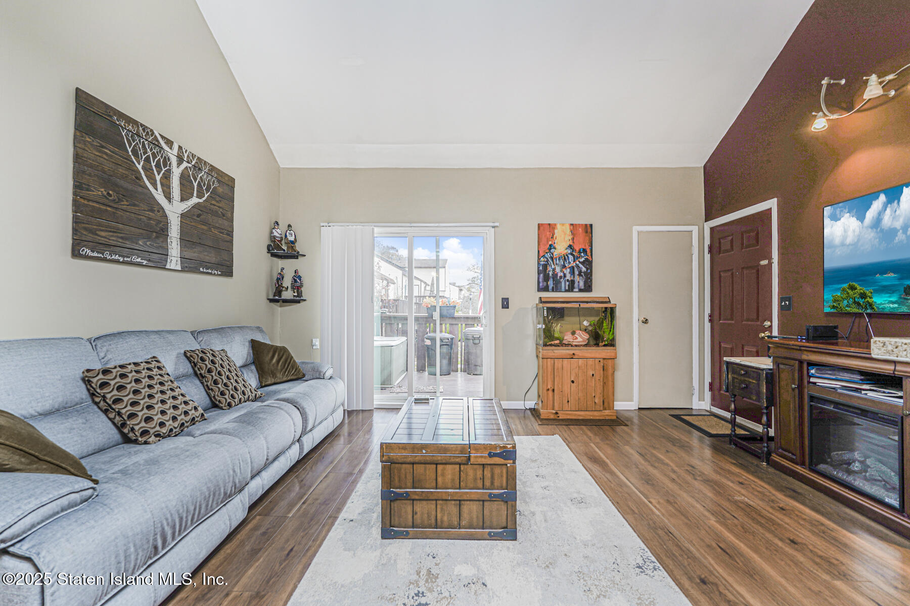 272 Timber Ridge Drive Staten Island, NY 10306 - Photo 8 of 26 a living room with furniture and a flat screen tv