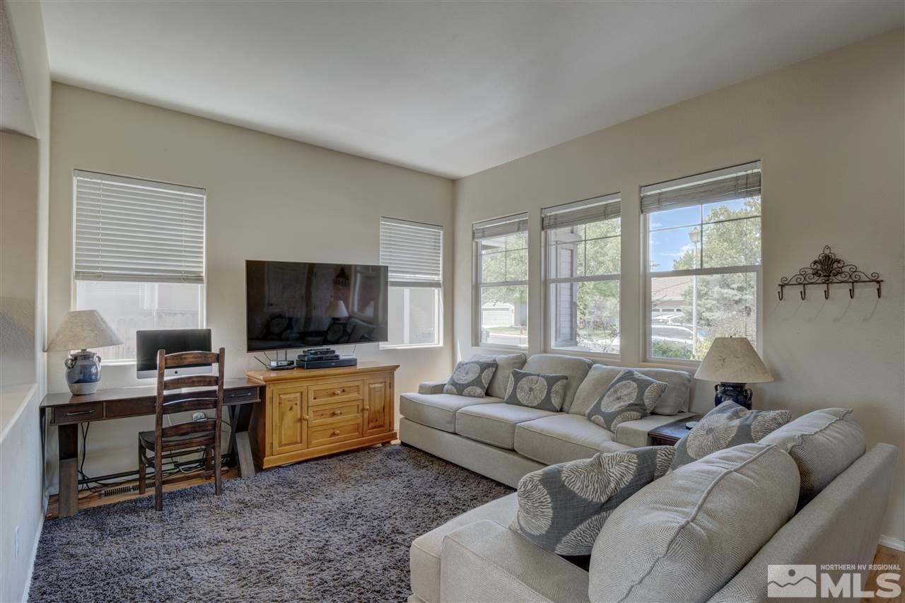 1660 Cattlemen Court Reno, NV 89521 - Photo 12 of 21 a living room with furniture and a flat screen tv