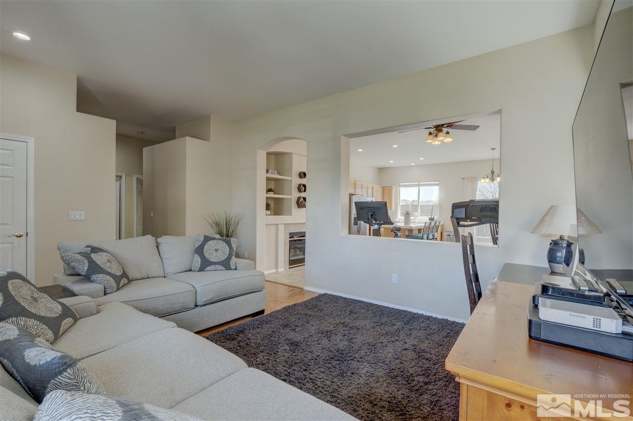 1660 Cattlemen Court Reno, NV 89521 - Photo 13 of 21 a living room with furniture and a wooden floor