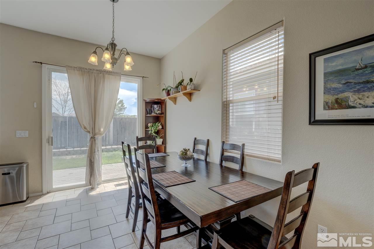 1660 Cattlemen Court Reno, NV 89521 - Photo 10 of 21 a view of a dining room with furniture window and outside view