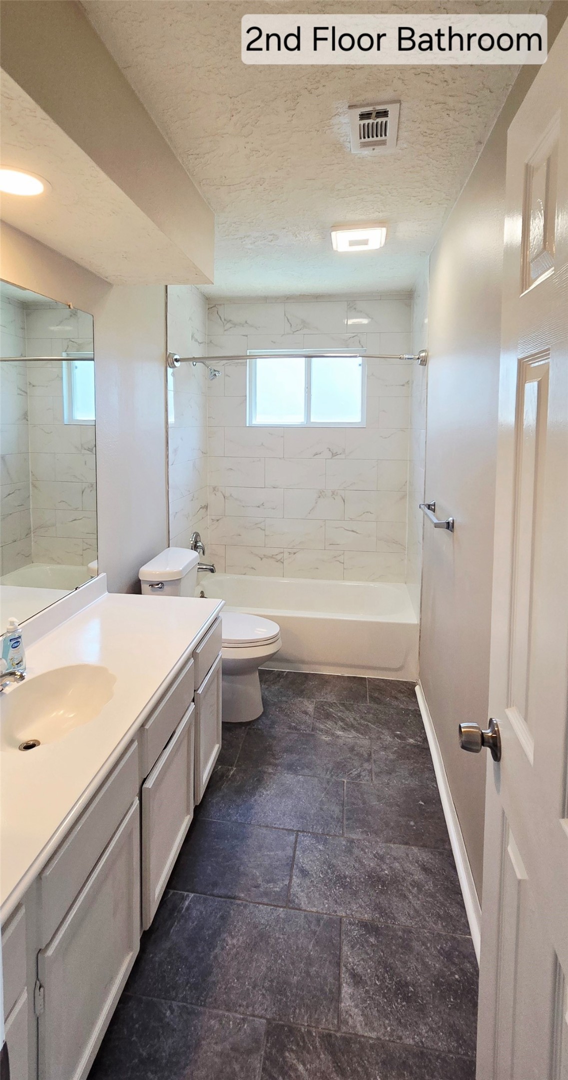 4827 Cypressdale Drive Spring, TX 77388 - Photo 31 of 35 a bathroom with a granite countertop sink a toilet and bathtub