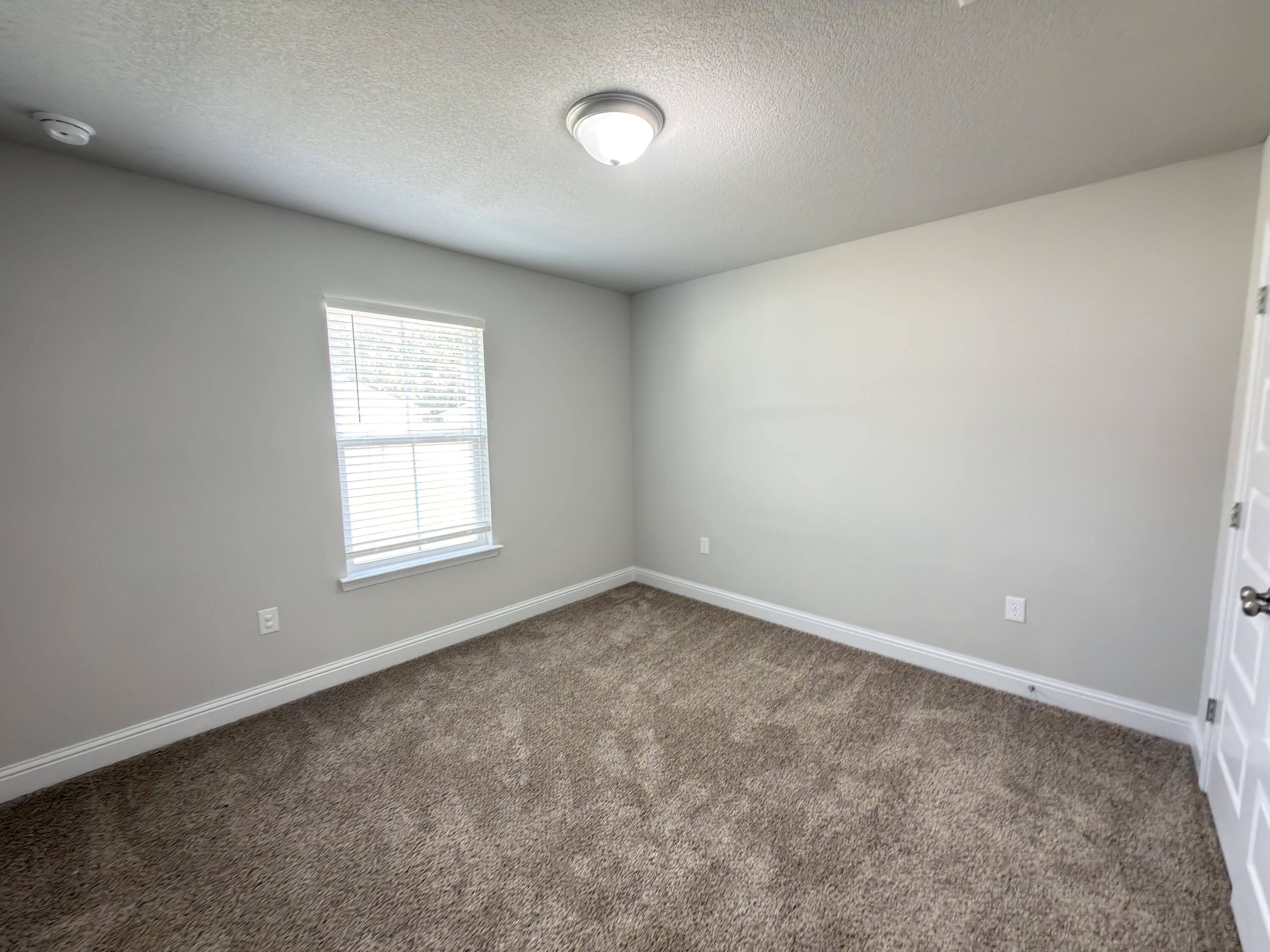 5281 Moore Loop Crestview, FL 32536 - Photo 11 of 28 an empty room with a window