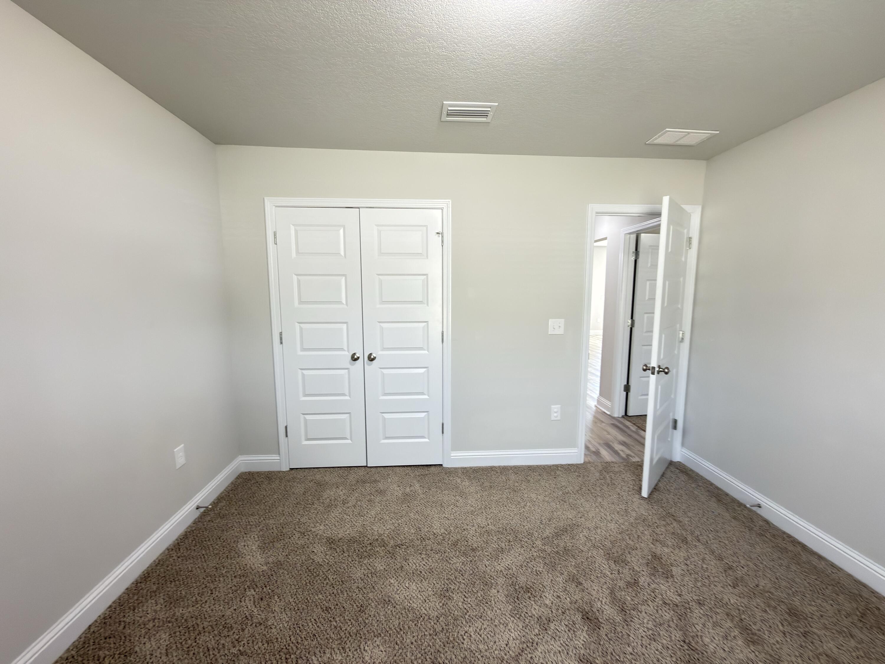 5281 Moore Loop Crestview, FL 32536 - Photo 12 of 28 an empty room with closet area