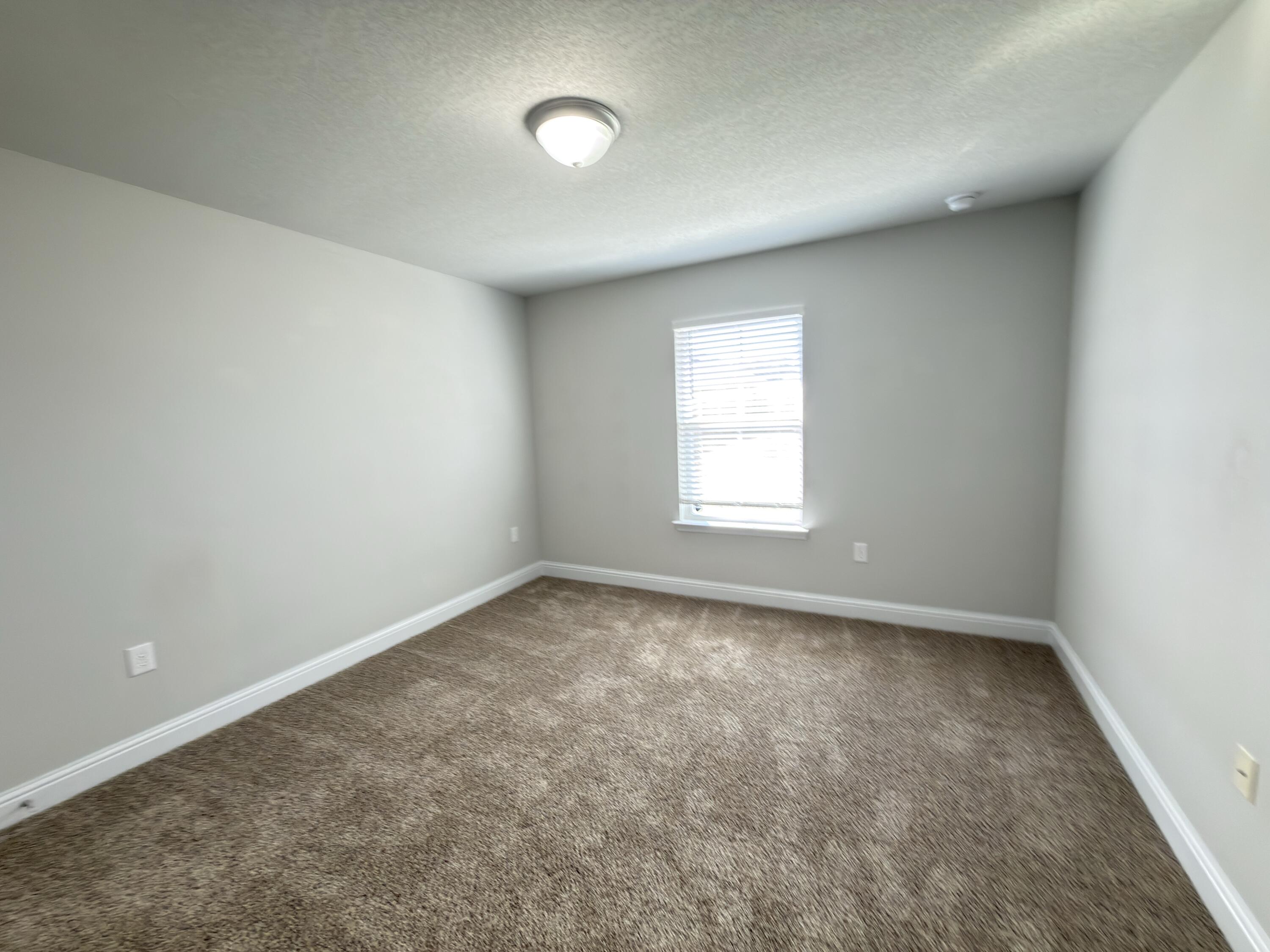 5281 Moore Loop Crestview, FL 32536 - Photo 14 of 28 an empty room with a window