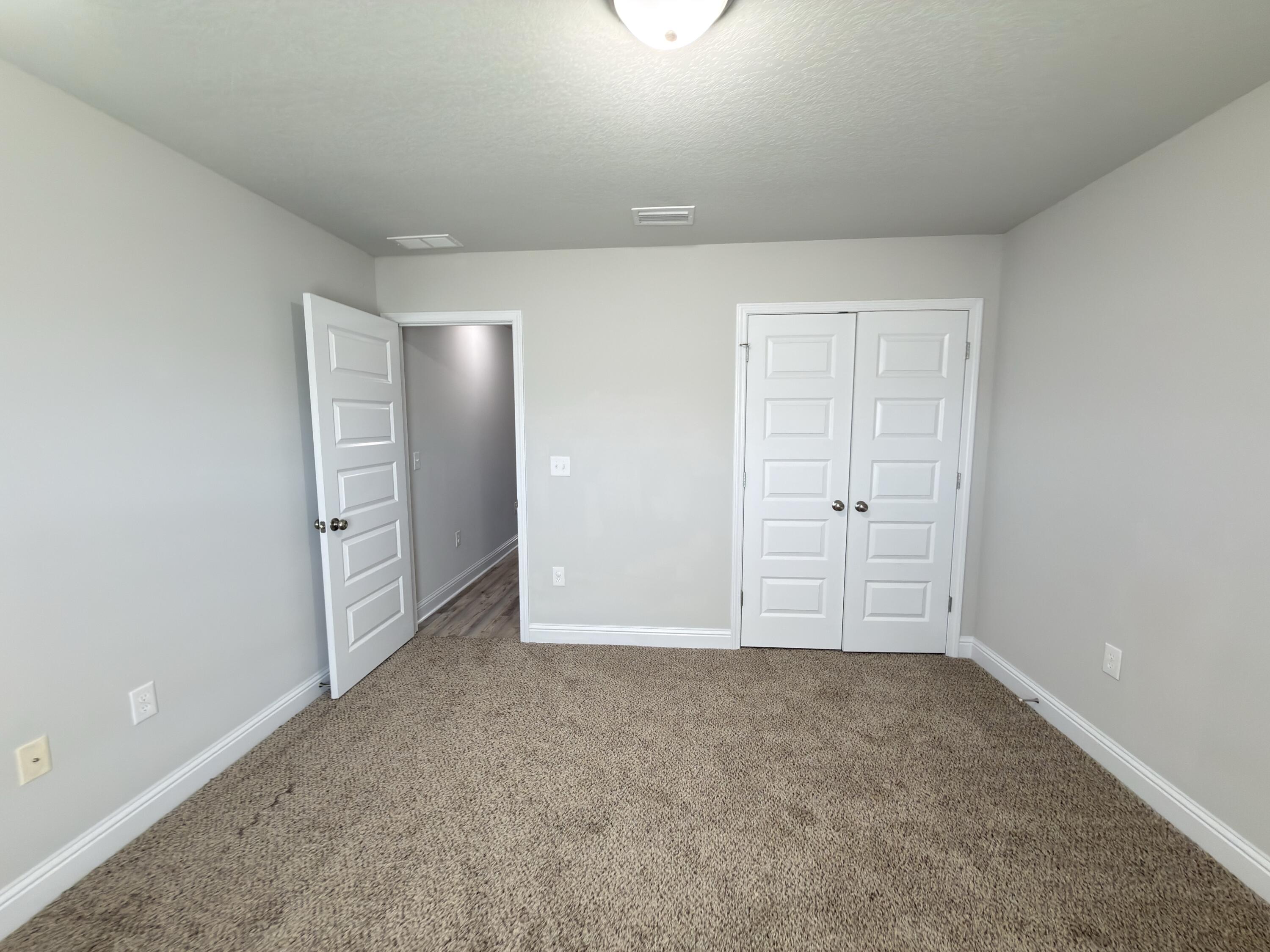5281 Moore Loop Crestview, FL 32536 - Photo 15 of 28 an empty room with closet area