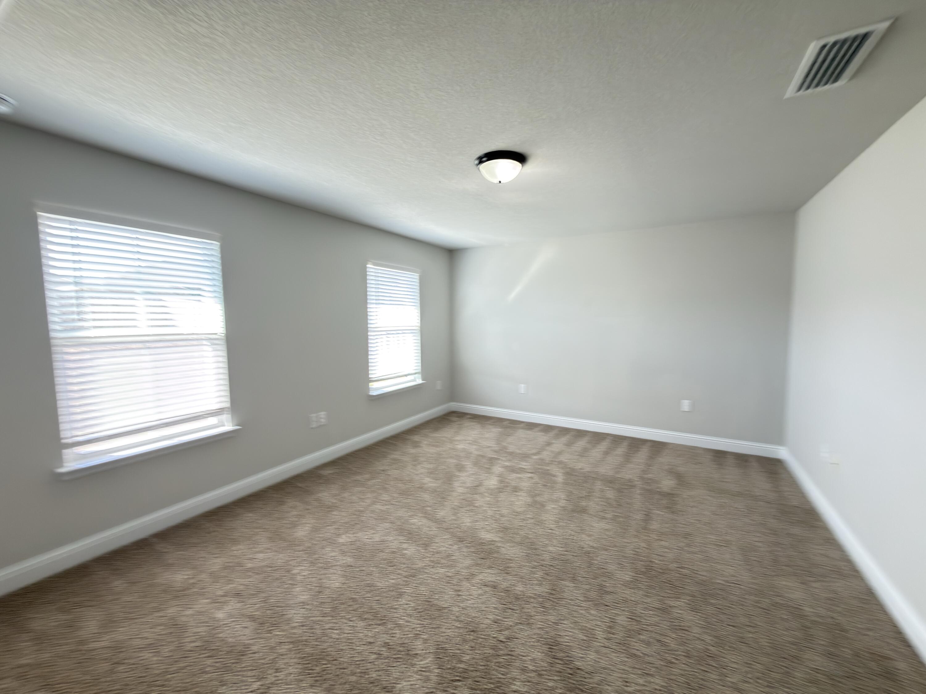 5281 Moore Loop Crestview, FL 32536 - Photo 16 of 28 an empty room with a window