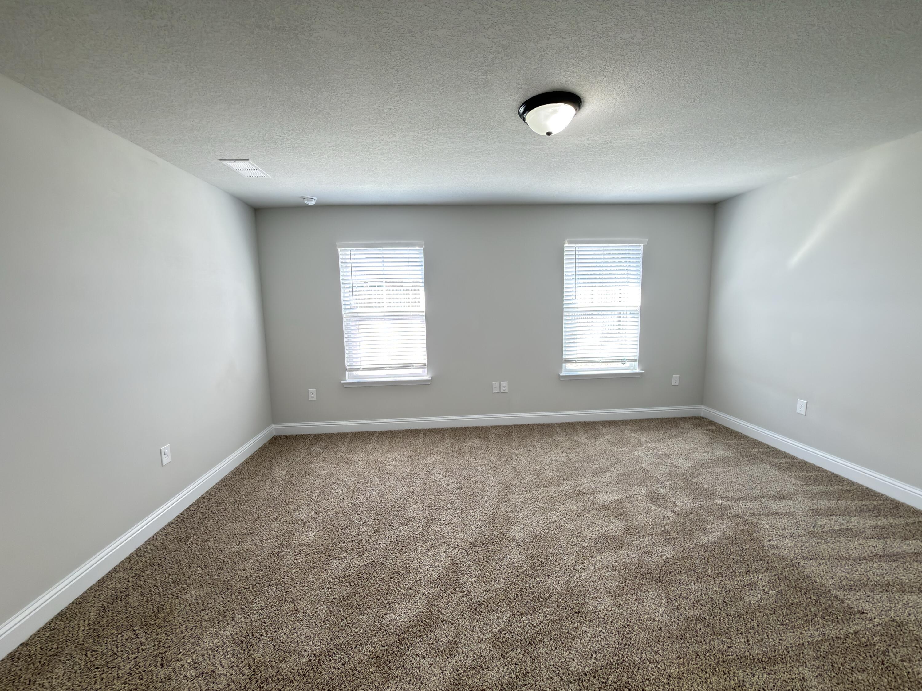 5281 Moore Loop Crestview, FL 32536 - Photo 18 of 28 an empty room with a window
