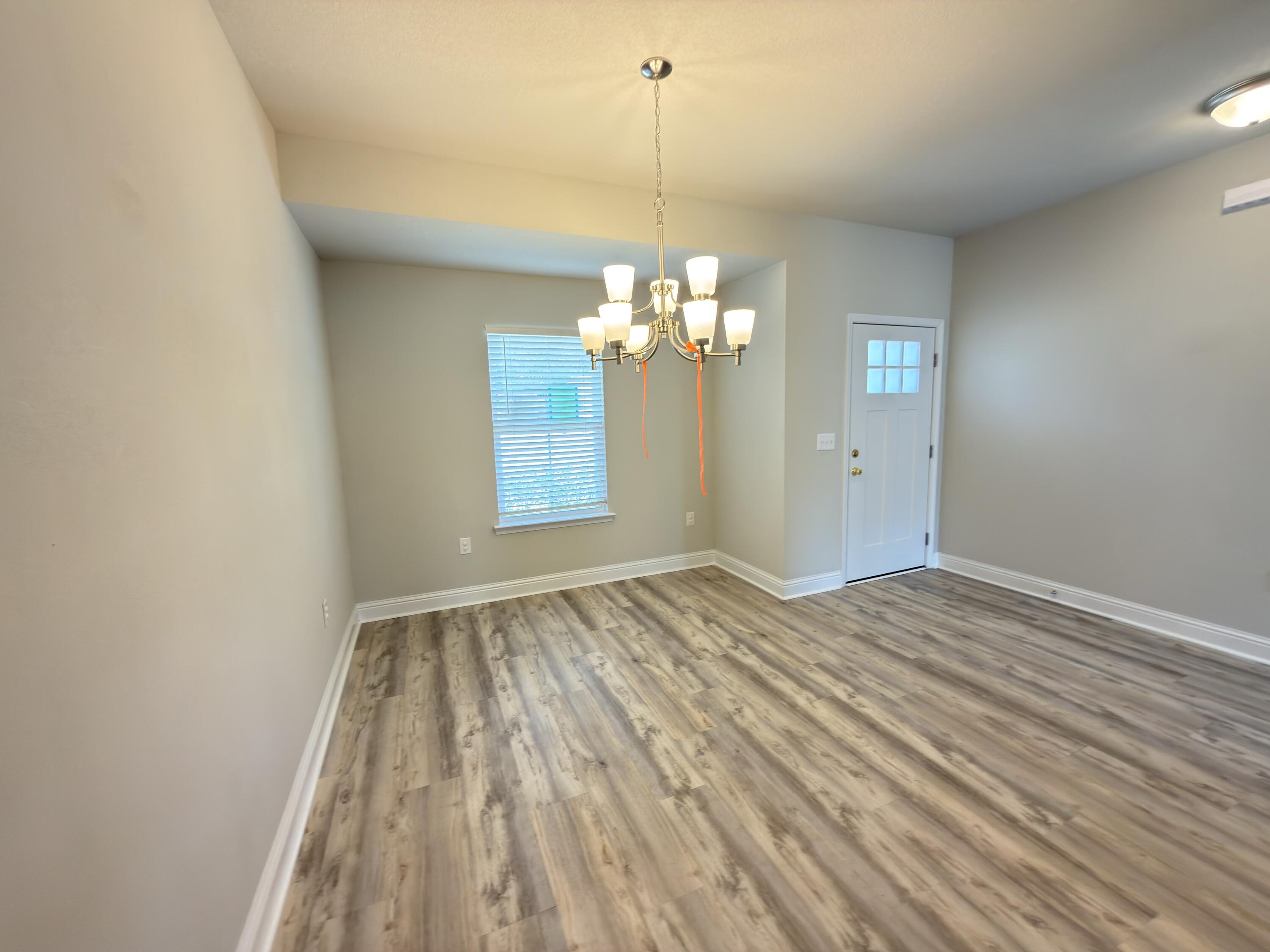 5281 Moore Loop Crestview, FL 32536 - Photo 24 of 28 a view of a room with wooden floor fan and window